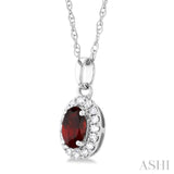5x3 MM Oval Shape Garnet and 1/20 Ctw Single Cut Diamond Halo Semi-Precious Pendant with Chain in 14K White Gold